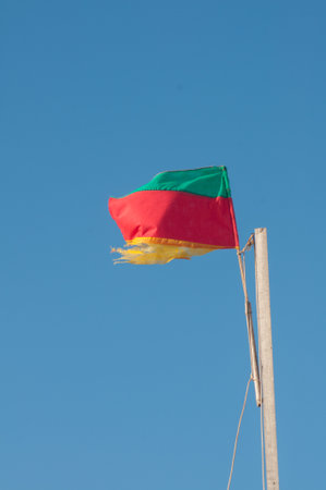 Rio Grande do Sul flag waving in the wind on blue sky backgroundの写真素材