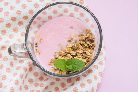 Healthy breakfast - strawberry smoothie with granola and mint.の写真素材