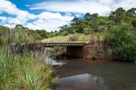 Old bridge over the river in brazilの写真素材