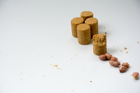PaÃ§oca, peanuts and crackers on a white background. Close-up.の写真素材