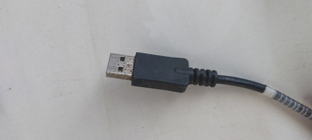 USB cable on a white background. Close-up of the cable.