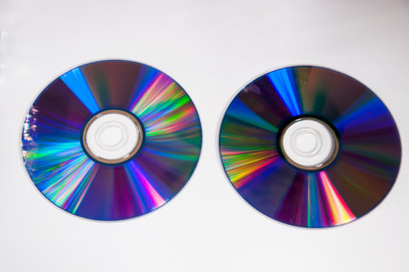 Compact discs on a white background. Close-up. Selective focus.の写真素材