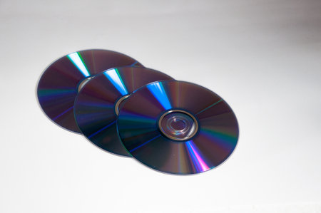compact discs isolated on a white background, closeup of photo