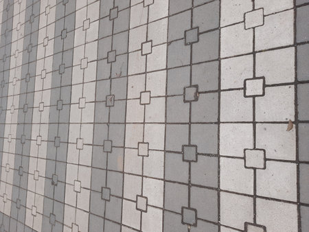 Close up of gray ceramic tile wall texture background, square pattern.