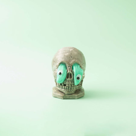 Pattern of green liquid and eyes leaking from the head of the skeleton. Holiday minimal concept.の写真素材