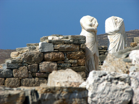 Stone headless statues of man and women in island Delos near the Mykonos,Greeceの写真素材