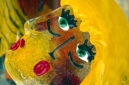 Coloured face sculpture hand made and hand painted from murano glassの写真素材