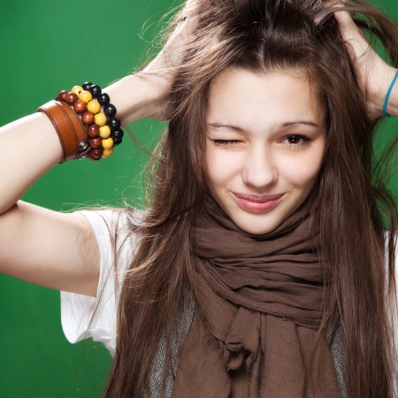 portrait of a teenage girl winking to cameraの写真素材