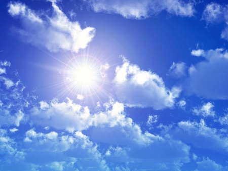 Blue Sky with Sun and Cloudsの写真素材