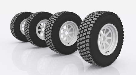 Four car tires against a white backgroundの写真素材