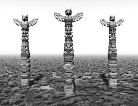 Three totem poles on the prairie in black and whiteの写真素材