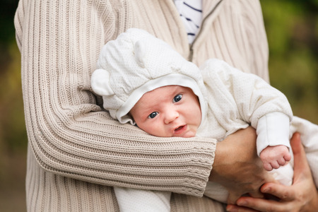 Portrait of adorable smiling newborn babyの写真素材