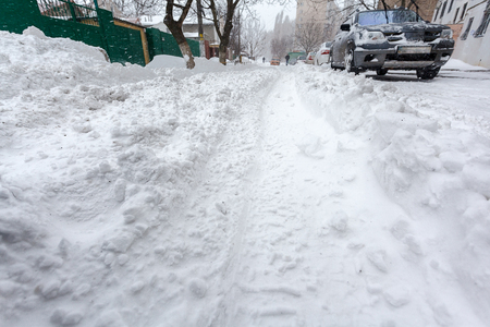 Winter street with lots of snow in Odessaの写真素材