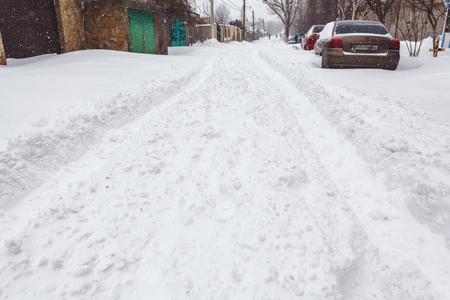 Winter street with lots of snow in Odessaの写真素材