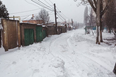 Winter street with lots of snow in Odessaの写真素材