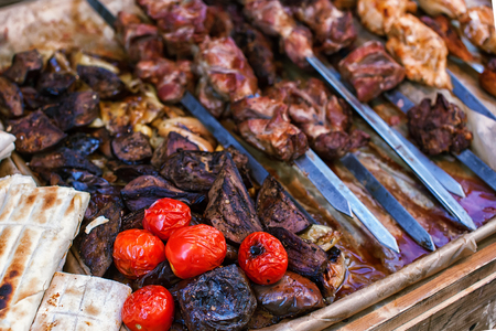 Barbecue Roasted Meat Shish Kebabs With Pepper and Onions On The Hot Grill. Good Snack For Outdoor Autumn Barbecue Party Or Picnicの写真素材