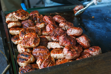 Chef making burgers outdoor on street food festival eventの写真素材
