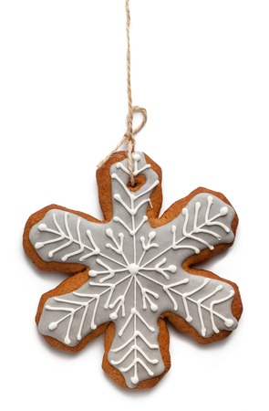Gingerbread cookie. Snowflake shape isolated on white backgroundの写真素材