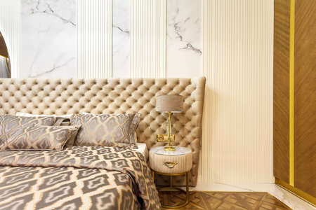 luxury hotel bedroom. Bed with carriage coupler headboardの写真素材