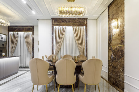 Marble dining table with crockery in a rich houseの写真素材