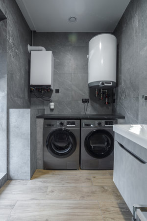 Modern furnished bathroom dark grey interior design with granite tilesの写真素材