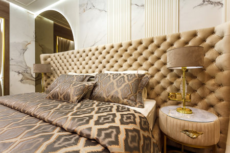 Luxury Interior Primary Bedroom Detail of Headboard and Bedding.の写真素材