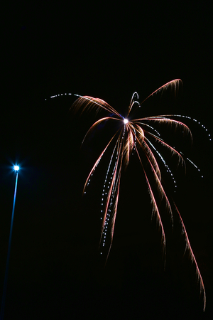 Fireworks and streetlightの写真素材