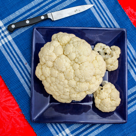 Cauliflower on blue plateの写真素材
