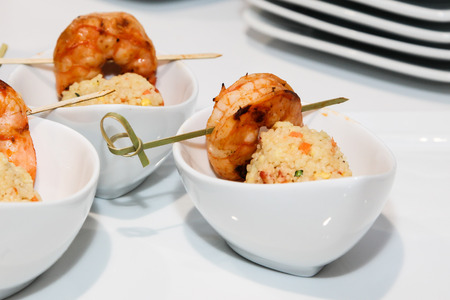 Shrim with rice inside small white plateの写真素材