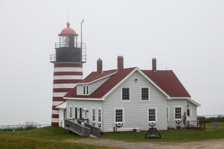 LUBEC-JULY 10: West Quody lighthouse in fogy day in Maine, USA on July 10, 2013.のeditorial素材