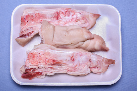 Fresh pork long feet in side package from storeの写真素材
