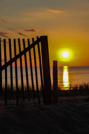Wooden fence with sunset sky in Cape Codの写真素材