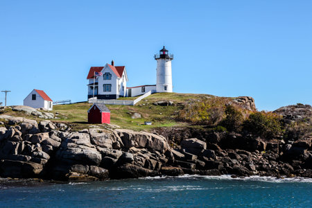 YORK, MAINE, USA - OCTOBER, 10, 2016: Cape Neddick "Nubble" Lighthouse in York with blue skyのeditorial素材