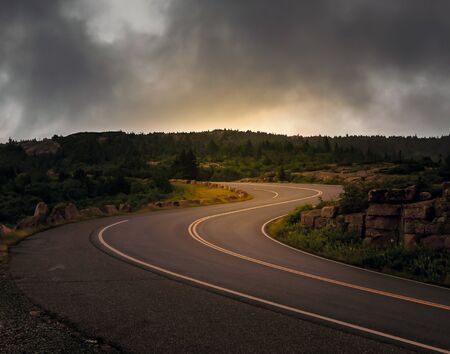 Mountain road in Acadia National Park with curved roadの写真素材