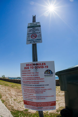 NORWALK, CT, USA - June 9, 2020: Informative sign on Calf Pasture Beach  during COVID-19 Pandemicのeditorial素材