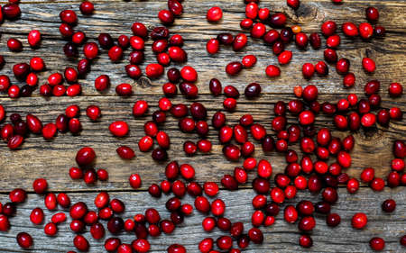 Cranberry on weathered wooden tableの写真素材