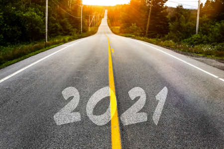 Rod in mountain  to new year with sunset and 2021 numberの写真素材