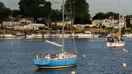 NORWALK, CT, USA - JUNE, 25, 2021: Evening lighs on boats and view from Veterans Parkのeditorial素材