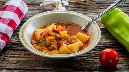 Home made tasty soup with sausages, tomatoes, pepper and tomato