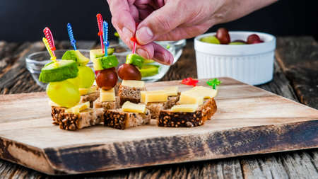 Finger food appetizer for party on wooden rustic tableの写真素材