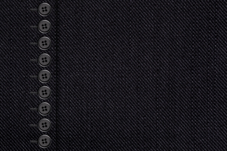 black cotton texture with bottons, closeup of grey canvas