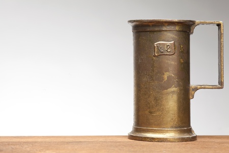 quarter liter brass measure on white backgroundの写真素材