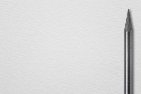 grey pencil on white paper background or black crayon on rough pattern stationeryの写真素材