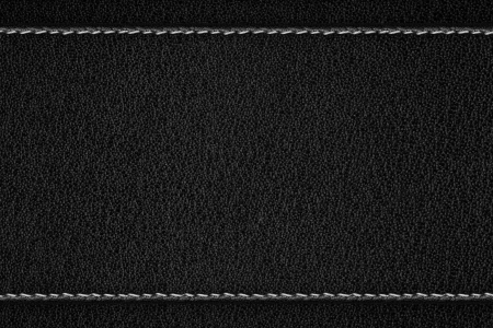 black leather background with white thread seamの写真素材