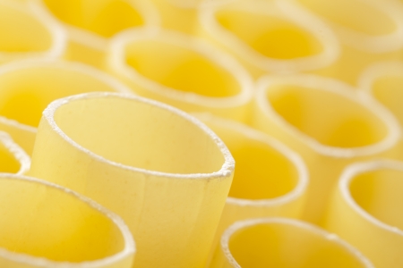 dried cannelloni background or yellow pasta textureの写真素材