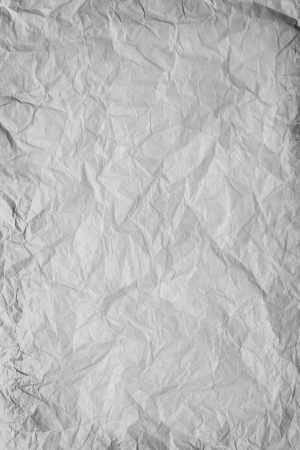 grey crumpled paper background or rough crumpled textureの写真素材