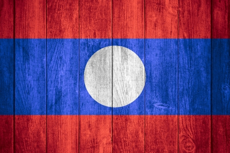 flag of Laos or white, red, blue and white  banner on wooden backgroundの写真素材