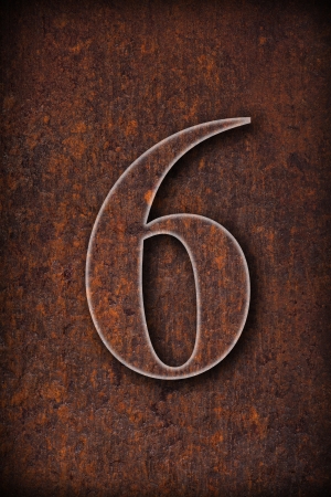 number six on rusty iron brown background の写真素材