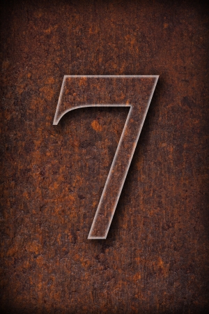  number seven on rusty iron brown background の写真素材