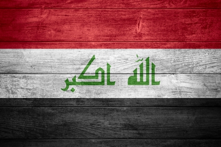flag of Iraq or  Iraqi banner on wooden backgroundの写真素材